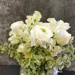 The University Florist - An elegant white arrangement made by student designer Callie!