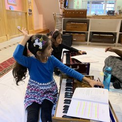 East Indian Music Academy - Raising hands to answer questions in class...
