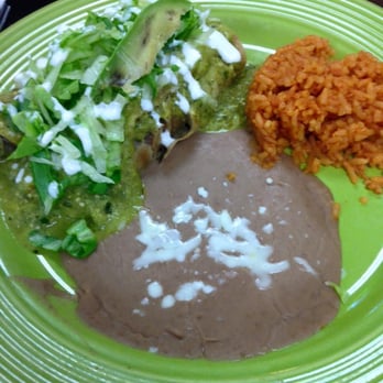 La Poblanita - Verde enchilada's with carnitas, rice, beans. Also, very good. - Mexican Near Me - Eau Claire, Wisconsin La Poblanita - Verde enchilada's with carnitas, rice, beans. Also, very good. - Mexican Near Me - Eau Claire, Wisconsin