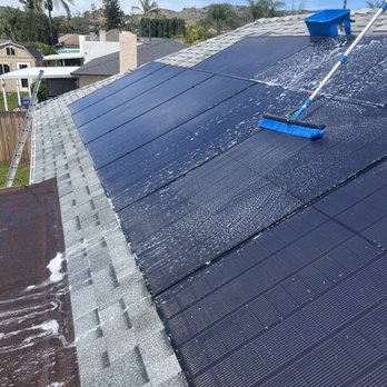 The CV Cleaning Services - Solar panels during cleaning. - Gutter Services Near Me