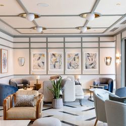 The Members Club lounge provides an elegant setting with comfortable seating, natural light, and thoughtfully designed spaces...
