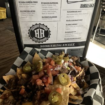 Happy Hours Bar & Grill - Nachos Supreme $7 during Happy Hour + $3 for beef - Bars Near Me - Palmdale, California