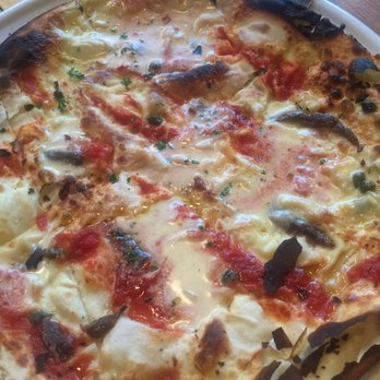 Caruggi - Pizzata from the chef's home town of Recco. Thin dough with tangy and creamy credenza cheese, anchovies, capers and passata. - Italian Near Me - Geelong, VIC