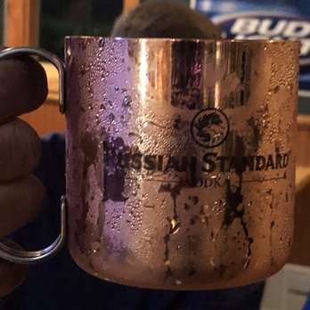 The Chateau - a person holding a copper mug - Bars Near Me - Mariah Hill, Indiana The Chateau - a person holding a copper mug - Bars Near Me - Mariah Hill, Indiana