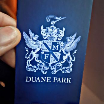Duane Park - a person holding a passport in their hand - Supper Clubs Near Me - New York, New York