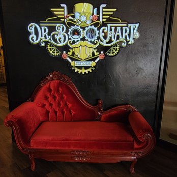 Dr Boochart - a red couch in front of a dr boochart sign - Kombucha Near Me - Escondido, California