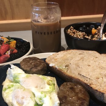 Five5eeds - Iced Latte, granola bowl w fruit, farm eggs, sausage with sourdough - Coffee & Tea Near Me - Park City, Utah Five5eeds - Iced Latte, granola bowl w fruit, farm eggs, sausage with sourdough - Coffee & Tea Near Me - Park City, Utah