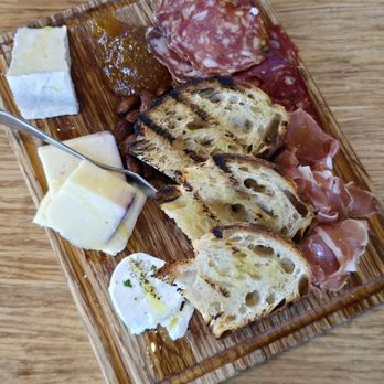The Spotted Duck - Charcuterie Board - Proscuitto di parma, sopressata, bella vitano, triple creme brie, goat cheese, almonds, grilled sourdough, fig jam - Desserts Near Me - Pacific Grove, California The Spotted Duck - Charcuterie Board - Proscuitto di parma, sopressata, bella vitano, triple creme brie, goat cheese, almonds, grilled sourdough, fig jam - Desserts Near Me - Pacific Grove, California