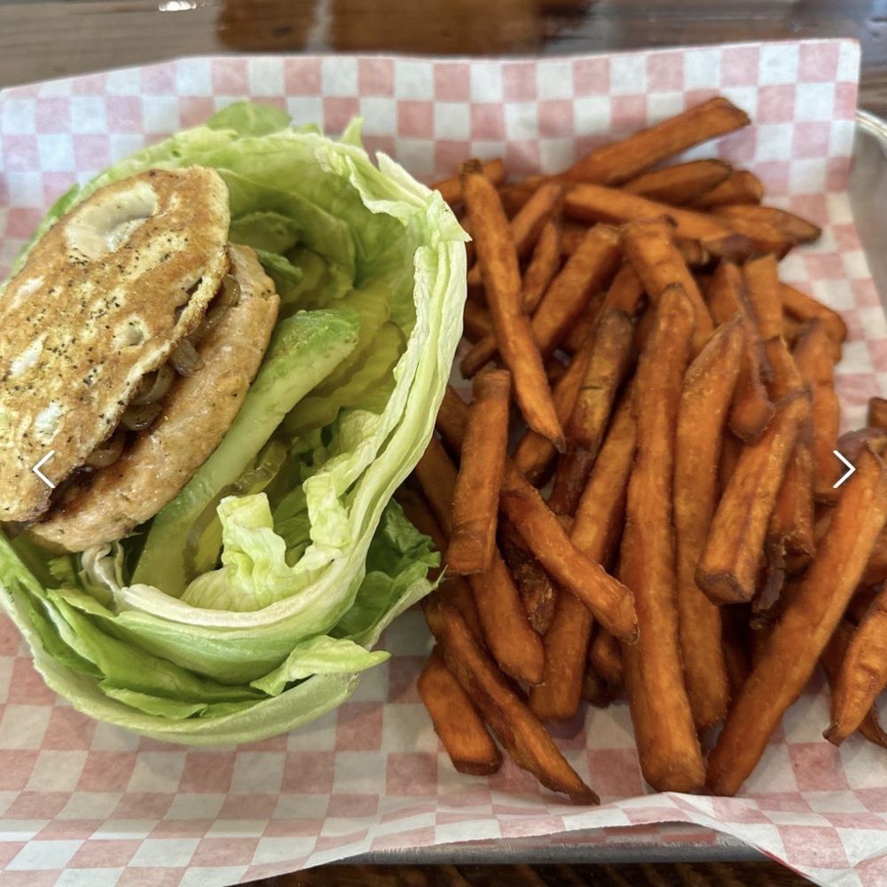 Burger 82 - Salmon Burger w/Fried Egg, Grilled Onions, Avocado and Lettuce Wrap w/Sweet Potato Fries - Burgers Near Me - Allen, Texas