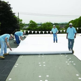 Commonwealth Roofing - workers working on a flat roof - Roofing Near Me - Louiseville, Kentucky Commonwealth Roofing - workers working on a flat roof - Roofing Near Me - Louiseville, Kentucky