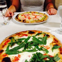 Pizzeria Le Gramaló - Pizza Italia with mozarella, straciatella cheese, cherry tomatoes and rucola; pizza with pesto, tomatoes, mozarella and ham