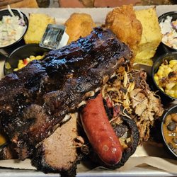 Riverhouse BBQ & Events - Family style dinner for 2. Great ribs. Excellent chicken. Average pulled pork. Dry beef brisket. Great cornbread. Average sides.