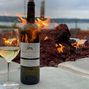 Cabernets & Ipas - a bottle of wine and a glass of wine - Wine Bars Near Me - Mukilteo, Washington