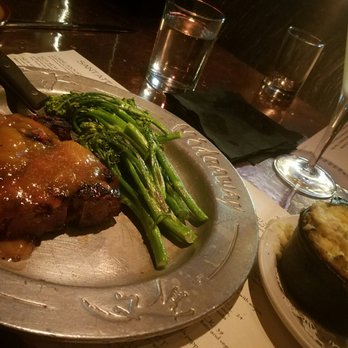 Rokerij - Pork chop with broccolini and mashed potatoes that my other half demolished. Don't forget the martini! - Seafood Near Me - Phoenix, Arizona