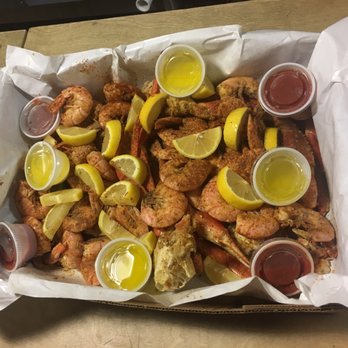 Macker Seafood - This is 10 snow crab clusters and 4.5 pounds of red shrimp! Soooo much butter! - Seafood Near Me - Daytona Beach, Florida