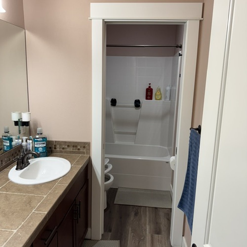 LC Builders - Old builder grade guest bathroom with a semi functioning pocket door. - Painters Near Me LC Builders - Old builder grade guest bathroom with a semi functioning pocket door. - Painters Near Me