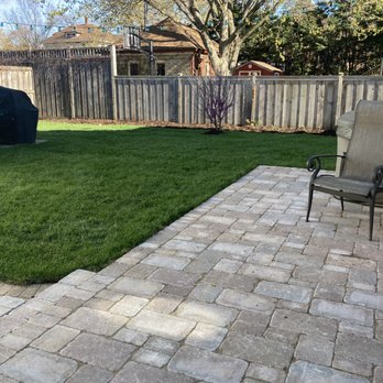 A Quest Landscape - Replaced wood deck with pavers, sodded, removed dead tree, added new tree and mulched - Landscaping Near Me