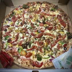Milanos Pizza - Veggie pizza on thin crust with added banana peppers and roasted red bell peppers.