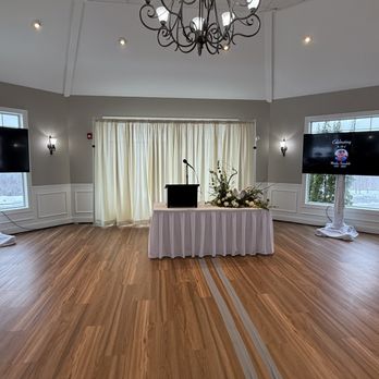 LPF Studio - Two 65" TVs on stands with stand covers, Mic with Tabletop Podium, and Pipe & Drape. - Video/Film Production Near Me LPF Studio - Two 65" TVs on stands with stand covers, Mic with Tabletop Podium, and Pipe & Drape. - Video/Film Production Near Me