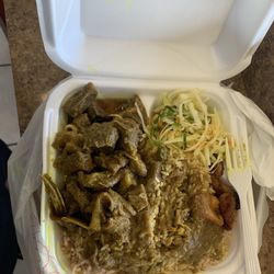 Bull Top Taste - Curry, goat, rice, and peas with cabbage and banana