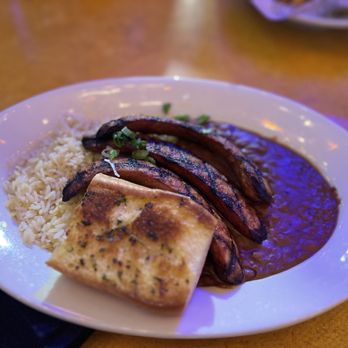 Razzoo's Cajun Cafe - Andouille Sausage over Red Beans N Rice - Cajun/Creole Near Me - Spring, Texas Razzoo's Cajun Cafe - Andouille Sausage over Red Beans N Rice - Cajun/Creole Near Me - Spring, Texas