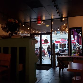 Roosters - a view of a restaurant through a glass door - Tacos Near Me - Mobile, Alabama Roosters - a view of a restaurant through a glass door - Tacos Near Me - Mobile, Alabama