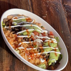 El Compa Grill - Burrito Bowl comes with choice of meat, rice, beans, lettuce, cheese, pico de gallo, guacamole, & sour cream