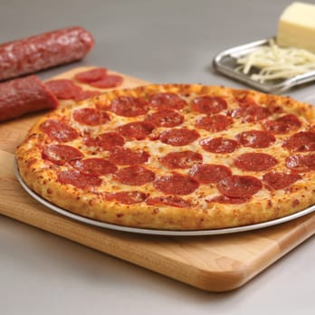 Domino's Pizza - a pepperoni pizza on a cutting board - Pizza Near Me - Mississauga, Ontario Domino's Pizza - a pepperoni pizza on a cutting board - Pizza Near Me - Mississauga, Ontario