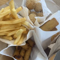 Pork lumpia Shanghai, vegetable lumpia, fries and sesame seed balls.