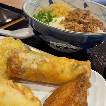 Marugame Udon - Bowl nikutama (hot broth) shredded beef, tempura flakes, green scallions,poached egg! Egg& ham filled egg roll, tempura surimi, & inari. - Japanese Near Me - Honolulu, Hawaii Marugame Udon - Bowl nikutama (hot broth) shredded beef, tempura flakes, green scallions,poached egg! Egg& ham filled egg roll, tempura surimi, & inari. - Japanese Near Me - Honolulu, Hawaii