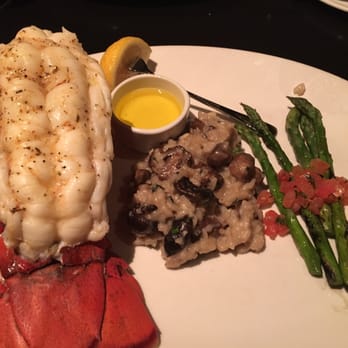 J. Gilbert's Wood-Fired Steaks & Seafood - One pound wood grilled lobster tail with mushroom risotto and asparagus. Fantastic! - Steakhouses Near Me - Overland Park, Kansas J. Gilbert's Wood-Fired Steaks & Seafood - One pound wood grilled lobster tail with mushroom risotto and asparagus. Fantastic! - Steakhouses Near Me - Overland Park, Kansas