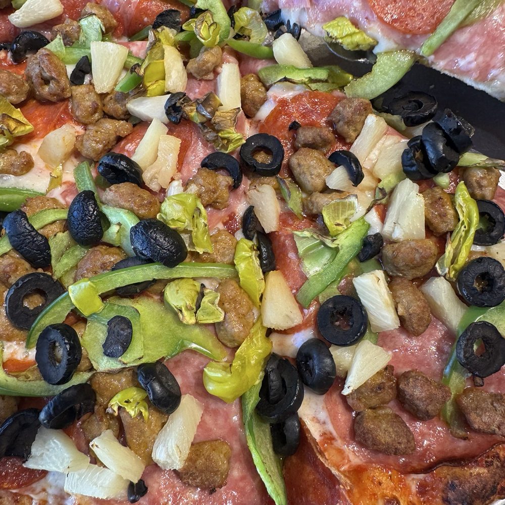 Yard Sale pizza with a couple of mods-- no mushrooms, no onions, add pineapple and pepperoncini. Yard Sale pizza with a couple of mods-- no mushrooms, no onions, add pineapple and pepperoncini.