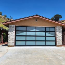 Simmons Garage Doors - Black anodized aluminum garage doors with full-view glass in white