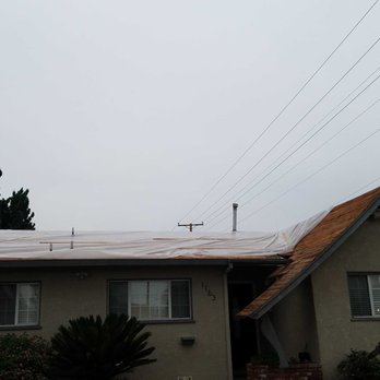 Rexway Roofing - Tarp on roof to protect from potential rain, following tearing old roof off - Roofing Near Me - La Puente, California