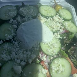 Spartan Gyros - Greek salad with 6 Kalamata olives, 3 on one corner, 3 on the other.