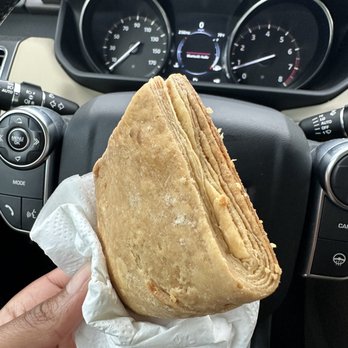 Immaculee Bakery II - a hand holding a pita - Bakeries Near Me - Brooklyn, New York Immaculee Bakery II - a hand holding a pita - Bakeries Near Me - Brooklyn, New York