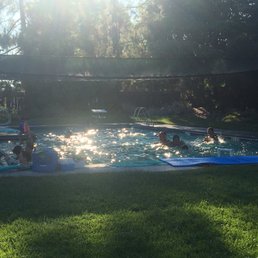 Overcrowded pool and hot dirt cement area parents watch from. Overcrowded pool and hot dirt cement area parents watch from.