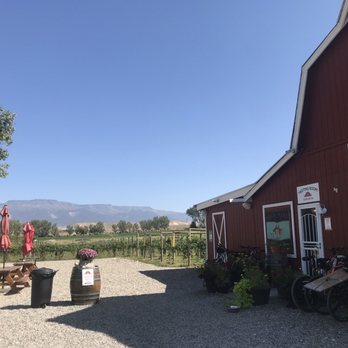 Peachfork - a red barn with bicycles parked outside - Farmers Market Near Me - Palisade, Colorado