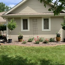 Cardinal Landscaping - Did a design for customers also added pavers to edge and redid retaining wall.