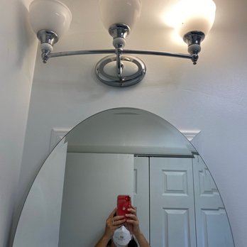 Tri County Development & Construction - Light fixture is hung upside down, off-center & too low to flip around. Mirror is round, but mounted on a visible square box. - General Contractors Near Me - Goshen, New York