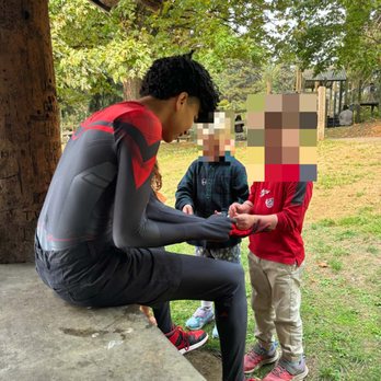 Ideas Alive - Spider-man (Miles Morales) putting temporary tattoos on two little kids - Party Characters Near Me - Seattle, Washington Ideas Alive - Spider-man (Miles Morales) putting temporary tattoos on two little kids - Party Characters Near Me - Seattle, Washington