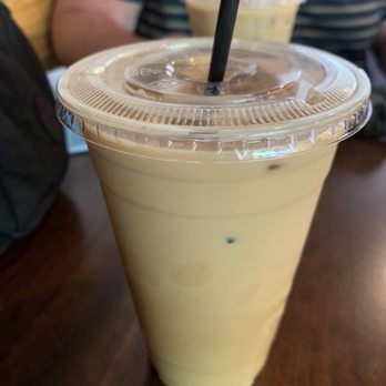 Gūd Coffee Company - 16oz Vanilla Rose Iced Latte with Oat Milk ($6.75) - Breakfast & Brunch Near Me - Valdosta, Georgia Gūd Coffee Company - 16oz Vanilla Rose Iced Latte with Oat Milk ($6.75) - Breakfast & Brunch Near Me - Valdosta, Georgia