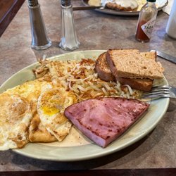 Lucky's Restaurant & Bar - Ham steak breakfast. It's a quarter chalice of an actual ham steak. Wth
