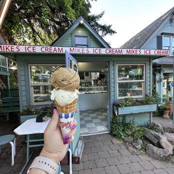Mike's Ice Cream - a hand holding an ice cream cone - Ice Cream & Frozen Yogurt Near Me - Hood River, Oregon Mike's Ice Cream - a hand holding an ice cream cone - Ice Cream & Frozen Yogurt Near Me - Hood River, Oregon