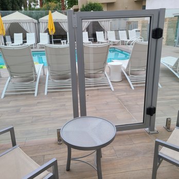 Hotel Paseo - patio does not open to pool but offers a view of it - Hotels Near Me - Palm Desert, California