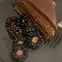 The Wanderlust Table - Dark chocolate mousse cake with fresh berries