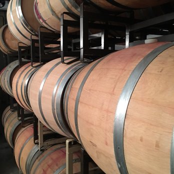 Y. Rousseau Wines - a row of wine barrels - Wine Tasting Room Near Me - Napa, California Y. Rousseau Wines - a row of wine barrels - Wine Tasting Room Near Me - Napa, California