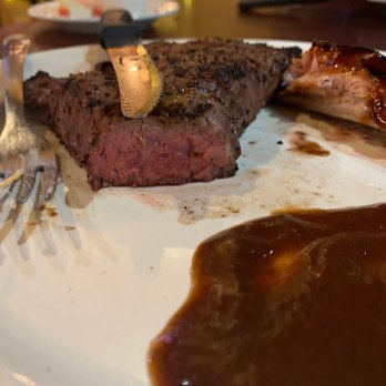 The Hungry Buffalo - Medium Rare NY strip with a rib bone stolen from my Husband's plate - American Near Me - Lakeside, Arizona
