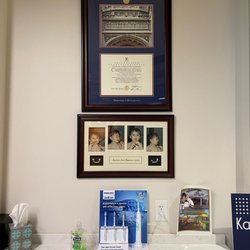 Kansas Dental Center - Photos in the lobby of Dr. Papinsick as a toddler, learning to brush his teeth! Maybe his mother had a premonition he'd become a Dentist!