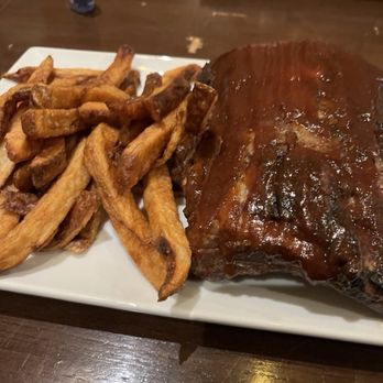 Stockyard Burgers & Bones - The half baby back ribs with frites( fries) - American Near Me - Atlanta, Georgia Stockyard Burgers & Bones - The half baby back ribs with frites( fries) - American Near Me - Atlanta, Georgia